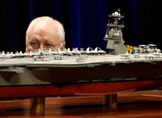 U.S. Vice President Dick Cheney is pictured behind a scale model of the new U.S. Navy aircraft carrier at the naming ceremony of the USS Gerald R. Ford at the Pentagon in Washington, January 16, 2007. The nuclear-powered aircraft carrier CVN 78, which Che