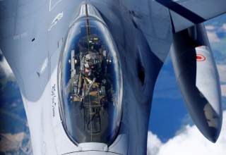A U.S. Air Force pilot looks at a KC-135 aerial refueling aircraft as he refuels his F-16 fighter during the U.S.-led Saber Strike exercise in the air over Estonia June 6, 2018. REUTERS/Ints Kalnins