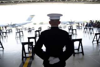 A U.S. Marine stands as caskets containing the remains of American servicemen from the Korean War handed over by North Korea arrive at Joint Base Pearl Harbor-Hickam in Honolulu, Hawaii, U.S., August 1, 2018. REUTERS/Hugh Gentry