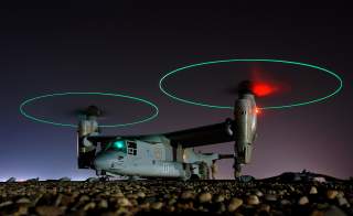 Crew members refuel an MV-22 before a night mission in Iraq, 2008