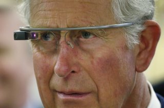 Britain's Prince Charles trys a pair of Google glasses to uses software developed at an innovation center in Winnipeg, Manitoba, May 21, 2014. The royal couple are on a four-day visit to Canada that began in Halifax and includes stops in Pictou, Nova Scot