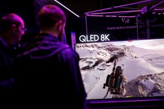Gamers play on a Samsung QLED 8K television at the Paris Games Week (PGW), a trade fair for video games in Paris, France, October 25, 2018. REUTERS/Benoit Tessier