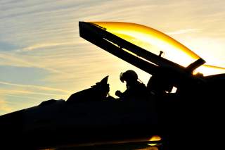 A U.S. Air Force pilot with the 480th Fighter Squadron (FS) performs a preflight functions check on an F-16 Fighting Falcon aircraft before leaving for Nordic Air Meet 2012 at Spangdahlem Air Base, Germany, Aug. 23, 2012.