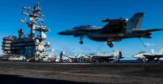 PHILIPPINE SEA (June 20, 2018) An EA-18G Growler assigned to Electronic Attack Squadron (VFA) 141 lands on the flight deck of the Navy's forward-deployed aircraft carrier, USS Ronald Reagan (CVN 76). Ronald Reagan, the flagship of Carrier Strike Group 5, 