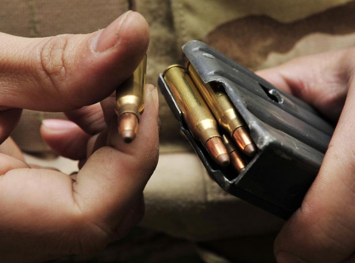 A student loads a magazine during the live-firing portion of a Combat Arms Training and Maintenance class on base Jan 21. The M-16A2 fires 5.56 mm semi-jacketed frangible rounds and each magazine holds up to 30 rounds. (U.S. Air Force photo by Airman 1st 