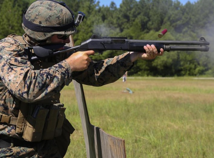 Sgt. James Jackson, Stone Bay alpha range line staff, fires a Benelli M4 shotgun at a target during a Combat Marksmanship Trainer Course at Camp Lejeune. Sep. 15, 2018. (U.S. Marine Corps photo by Cpl. Mark Watola /Released)