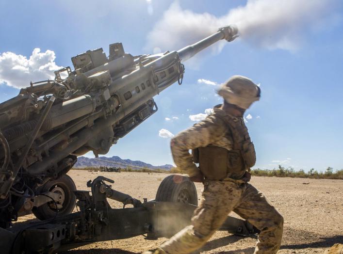 Marine Corps Cpl. Eduardo Osorionunez fires an M777 howitzer during a battle drill at Fire Base Burt, Calif., Oct. 1, 2016.