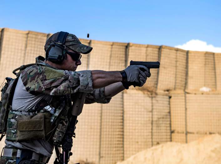 An Air Force pararescueman fires his Glock 9 mm handgun during weapons training at Bagram Airfield, Afghanistan, Feb. 21, 2018. Air Force photo by Tech. Sgt. Gregory Brook