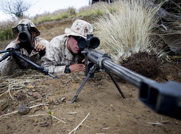 U.S. Marines attached to Scout Sniper Platoon, Weapons Company, 1st Battalion, 3rd Marine Regiment, "The Lava Dogs" pose as a Sniper Spotter team with the M107 .50-caliber Sniper Rifle at Lava Viper aboard Pohakuloa Training Area, Hawaii, June 3, 2015.(U.