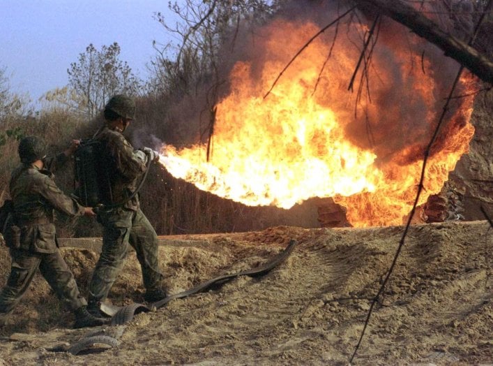 Taiwanese soldiers use flamethrowers during a practice drill at a military base in the southern county of Chiayi January 30. The armed forces here usually step up training before the Chinese lunar new year which falls on February 7 to increase their comba