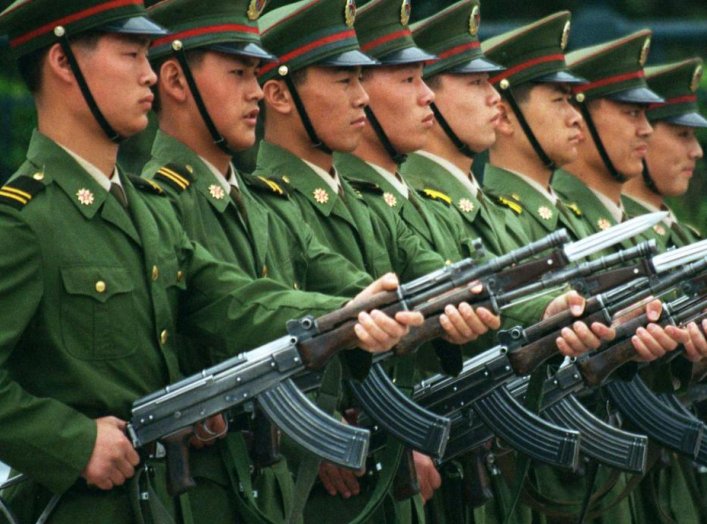 Chinese soldiers perform drills with semi-automatic rifles June 3 in front of Beijing's Great Hall of the People in Tiananmen Square on the eve of the ninth anniversary of the 1989 Tiananmen Square massacre.