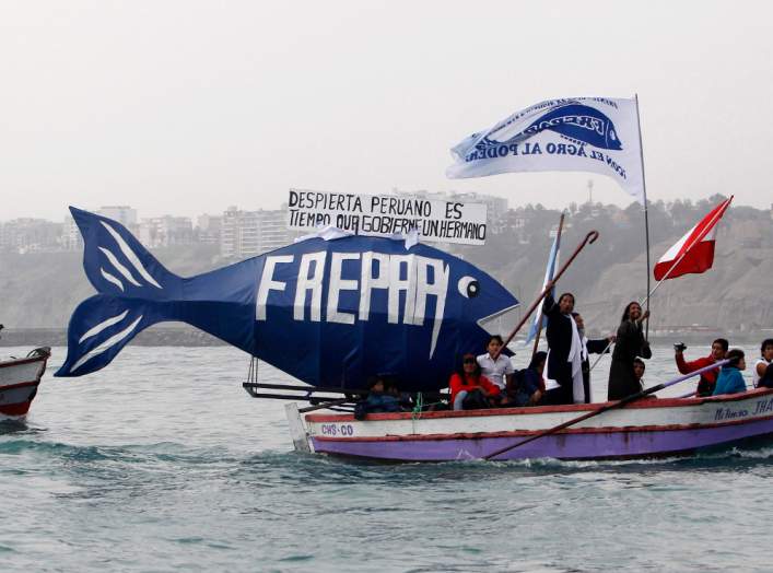 Members of FREPAP, a religious and political movement, take part in the Saint Peter festival in the fishing town of Chorrillos June 29, 2010. Devotees of Saint Peter, the patron saint of fishermen, took part in the celebrations in the hope of good catches