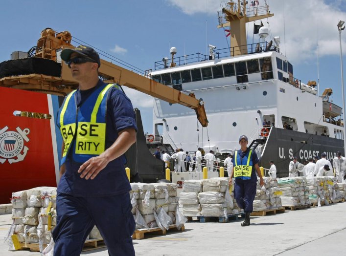 Crew members from the U.S. Coast Guard Cutter Oak unload 15,000 pounds (6,804 kg) of cocaine worth more than $180 million at Base Support Unit Miami August 2, 2011. The haul was recovered from a self propelled submersible vessel in the western Caribbean
