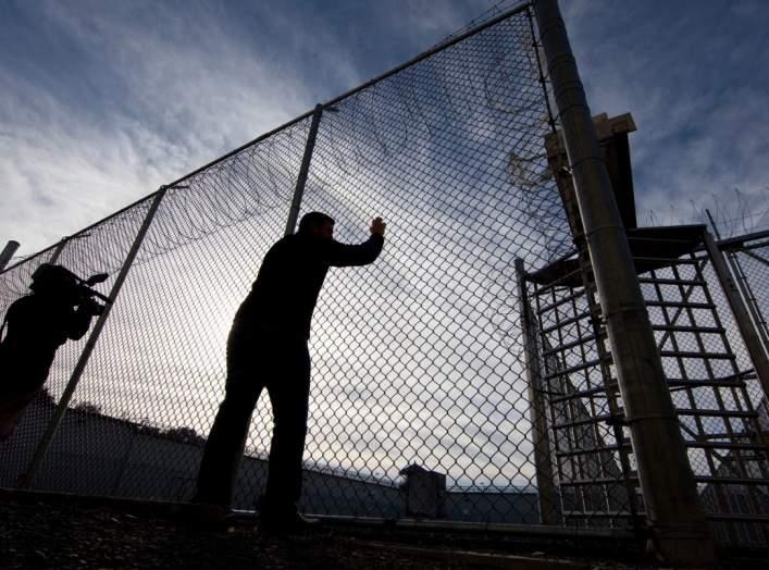 A view of gates to an exercise yard for inmates at Kingston Penitentiary in Kingston, Ontario October 11, 2013. REUTERS/Fred Thornhill