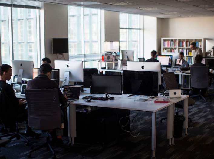 Employees work inside the Minerva Project office in San Francisco, California January 7, 2014.