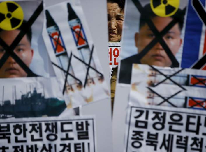 A woman from an anti-North Korea and conservative civic group attends a rally marking the fifth anniversary of the sinking naval ship Cheonan in central Seoul March 26, 2015.
