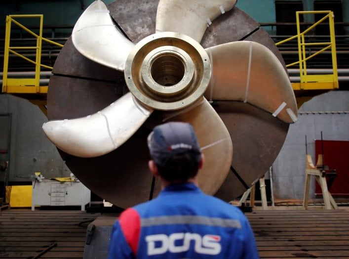 An employee looks at the propeller of a Scorpen submarine at the industrial site of the naval defence company and shipbuilder DCNS in La Montagne near Nantes, France, April 26, 2016. REUTERS/Stephane Mahe