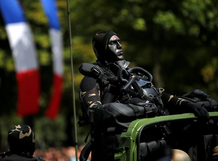 A camouflaged special forces member attends the traditional Bastille day military parade on the Champs-Elysees in Paris, France, July 14, 2017. REUTERS/Stephane Mahe