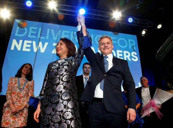 New Zealand Prime Minister Bill English and his wife Mary react on stage alongside family members during an election night event in Auckland, New Zealand, September 23, 2017. REUTERS/Nigel Marple