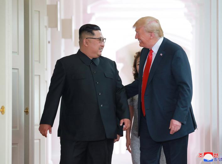 U.S. President Donald Trump walks with North Korean leader Kim Jong Un at the Capella Hotel on Sentosa island in Singapore in this picture released on June 12, 2018 by North Korea's Korean Central News Agency. KCNA via REUTERS