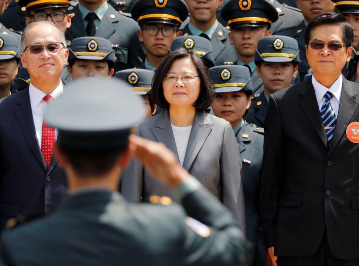 A soldier salutes (L-R) Director of the Institute for National Security Studies Feng Shih-kuan, Taiwanese President Tsai Ing-wen, and Minister of National Defense Yen Teh-fa afterthe joint military academies graduation ceremony, in Taipei, Taiwan June 29,