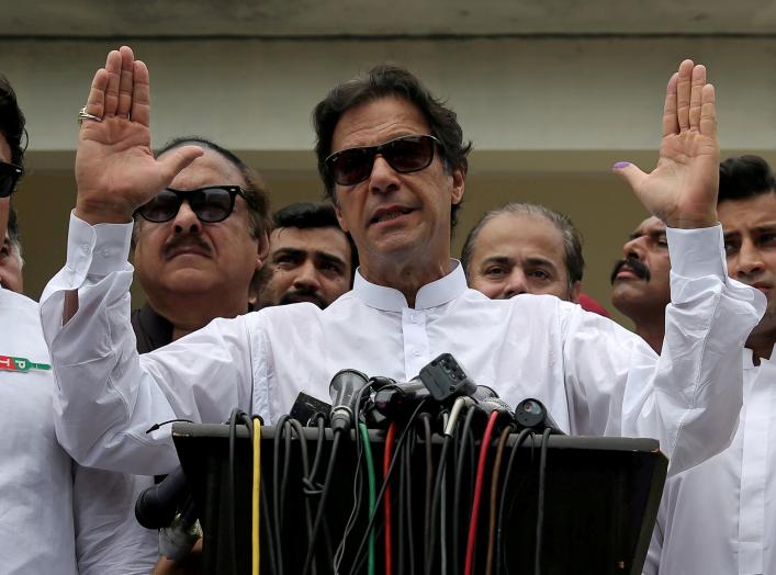 Cricket star-turned-politician Imran Khan, chairman of Pakistan Tehreek-e-Insaf (PTI), speaks after voting in the general election in Islamabad, Pakistan July 25, 2018. REUTERS/Athit Perawongmetha/File Photo
