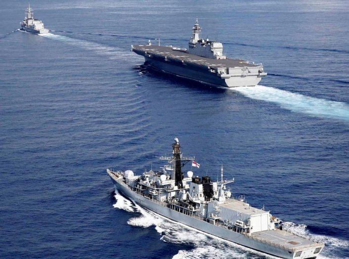 British frigate HMS Argyll (front), Japanese helicopter carrier Kaga (C) and Japanese destroyer Inazuma take part in a joint naval drill in the Indian Ocean, September 26, 2018. Picture taken on September 26, 2018. REUTERS/Kim Kyung-Hoon