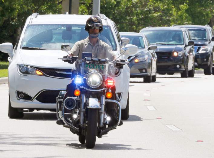 Miami-Dade police motorcycle officers escort a motorcade to FBI headquarters in Miramar, Florida, U.S. October 26, 2018. REUTERS/Joe Skipper