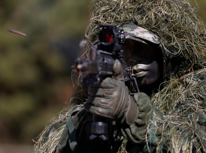A South Korean marine in action during their regular drill on Yeonpyeong Island, South Korea November 1, 2018. Jeon Heon-Kyun/Pool via REUTERS TPX IMAGES OF THE DAY