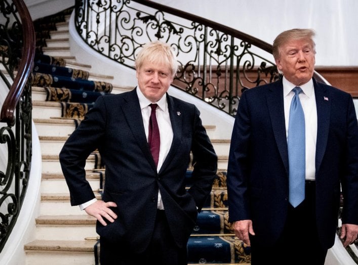 U.S. President Donald Trump and Britain's Prime Minister Boris Johnson arrive for a bilateral meeting during the G7 summit in Biarritz, France, August 25, 2019. Erin Schaff/Pool via REUTERS