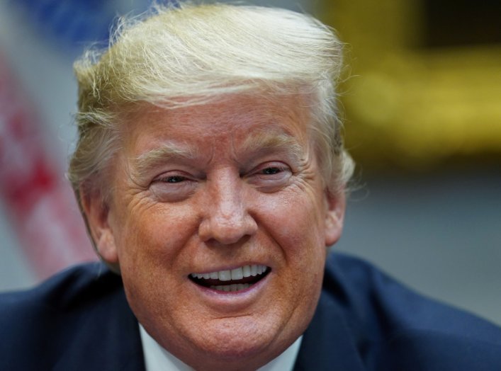 President Donald Trump laughs as he speaks while participating in a "roundtable on small business and red tape reduction accomplishments" in the Roosevelt Room at the White House in Washington, U.S. December 6, 2019. REUTERS/Kevin Lamarque