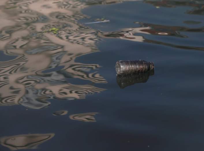 A plastic bottle is seen as a group of volunteers collect trash in the Chao Praya river to raise public awareness on the damage single-use plastic has on the environment in Bangkok, Thailand, December 21, 2018. REUTERS/Soe Zeya Tun