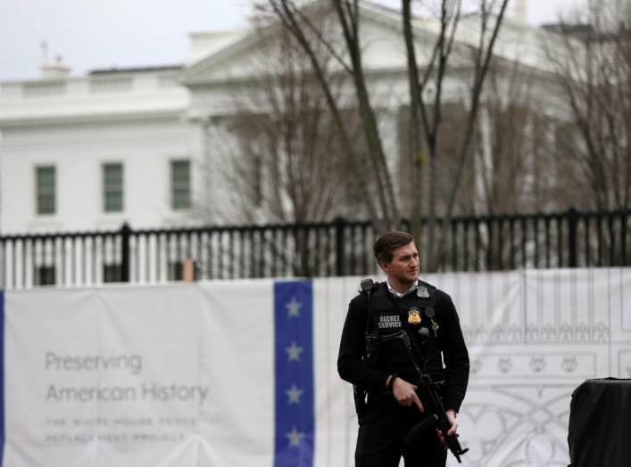 FILE PHOTO: A Secret Service agent stands guard outside the White House in Washington, U.S., January 3, 2020. REUTERS/Leah Millis/File Photo