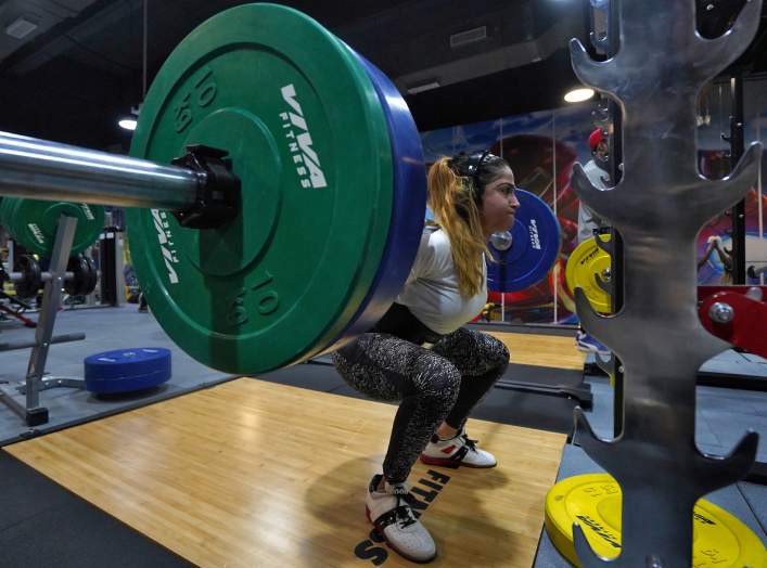 Fitness instructor Fatema Dhoondia, 30, a Muslim woman and a single mother, lifts weights inside a gym in Mumbai, India, December 31, 2019. Picture taken December 31, 2019. REUTERS/Hemanshi Kamani