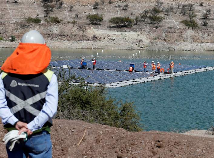 FILE PHOTO: Solar panels are seen during the inauguration of the world’s first-ever 'island' of solar panels in a tailings pond of Anglo American's Los Bronces copper mine, on the outskirts of Santiago, Chile March 14, 2019. REUTERS/Rodrigo Garrido