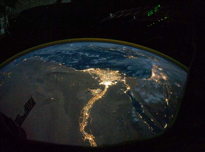 A NASA satellite image, taken by one of the Expedition 25 crew members on the International Space Station, shows the lights of Cairo, Alexandria and the Nile River, Egypt October 28, 2010. Picture taken October 28, 2010. NASA/Handout via REUTERS