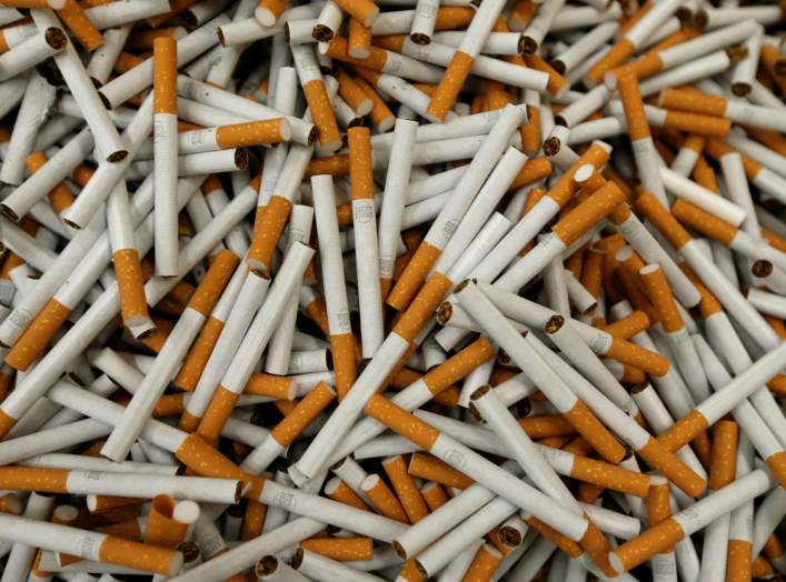 FILE PHOTO: Cigarettes are seen during the manufacturing process in the British American Tobacco Cigarette Factory (BAT) in Bayreuth, southern Germany, April 30, 2014. Picture taken April 30, 2014. REUTERS/Michaela Rehle/File Photo