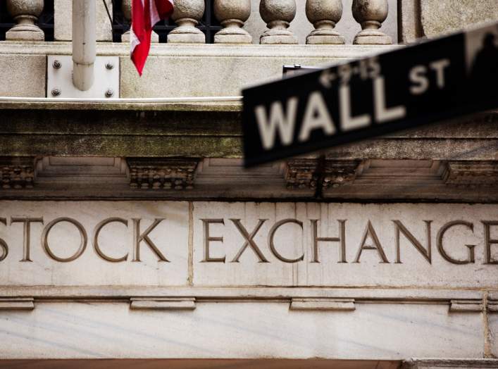 A street sign for Wall Street hangs in front of the New York Stock Exchange May 8, 2013. REUTERS/Lucas Jackson