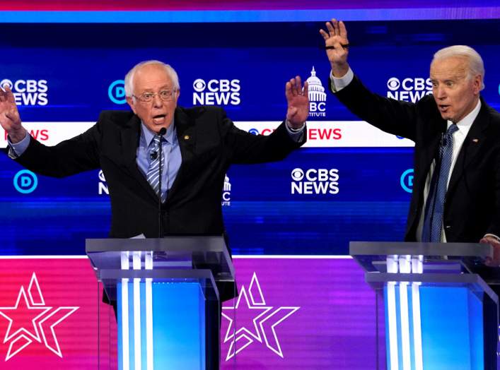 Democratic 2020 U.S. presidential candidates Senator Bernie Sanders and former Vice President Joe Biden talk at the tenth Democratic 2020 presidential debate at the Gaillard Center in Charleston, South Carolina, U.S. February 25, 2020