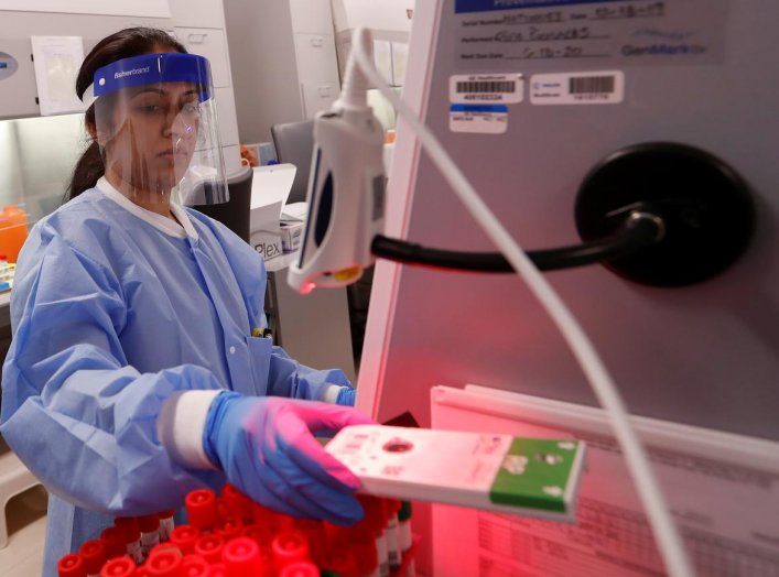 A medical technologist tests a respiratory panel at Northwell Health Labs, where the same test will be used on the COVID-19, the disease caused by the novel coronavirus, after being authorized to begin semi-automated testing by the US Food and Drug Admini