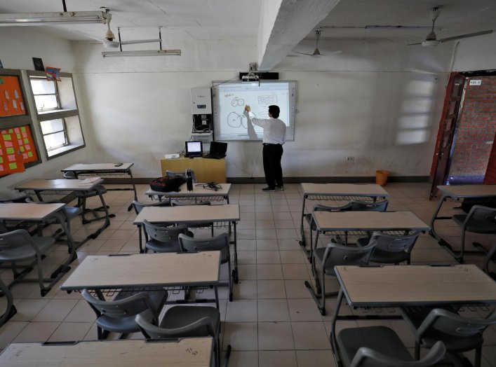 A teacher takes an online class for his students inside a private school after Gujarat government ordered the closure of schools and colleges across the state amid coronavirus fears, in Ahmedabad, India, March 17,2020. REUTERS/Amit Dave