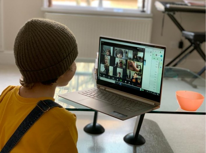 A school kid socializes with peers online following school closures due the spread of the coronavirus disease (COVID-19) outbreak, in London, Britain, March 20, 2020 in this picture obtained from social media on March 25, 2020. Anais Aguerre/via REUTERS