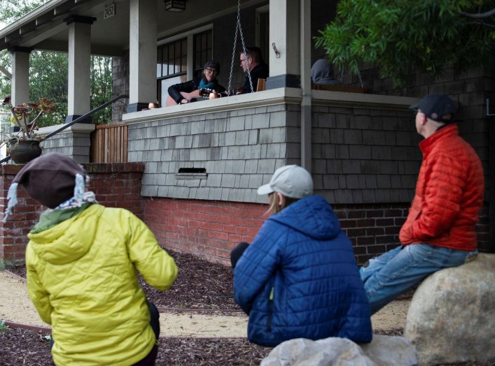 Musicians perform as part of a series of porch concerts during the lockdown against the spread of coronavirus disease (COVID-19) in Alameda, California, U.S. March 27, 2020. REUTERS/Kate Munsch