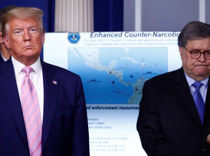 U.S. President Donald Trump and U.S. Attorney General Bill Barr listen as the Trump administration and military leaders announce naval moves against Venezuela and narcotics traficking during the daily coronavirus response briefing at the White House