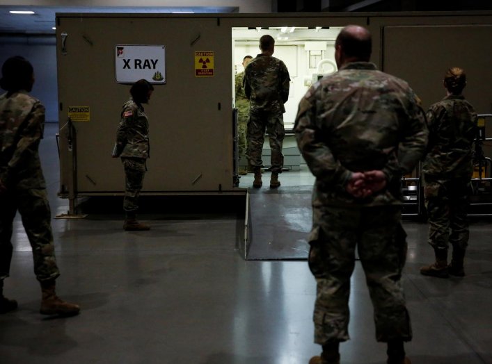 Army Chief of Staff General James McConville inspects the radiology unit at a military field hospital for non-coronavirus patients inside CenturyLink Field Event Center during the coronavirus disease (COVID-19) outbreak in Seattle, Washington, U.S., April