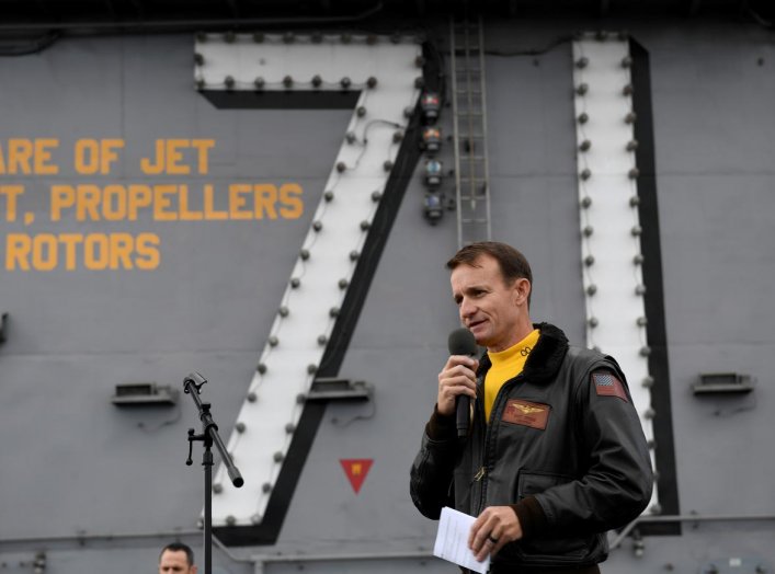 Captain Brett Crozier, commanding officer of the U.S. Navy aircraft carrier USS Theodore Roosevelt, addresses the crew during an all-hands call on the ship’s flight deck in the eastern Pacific Ocean December 19, 2019. Picture taken December 19, 2019. U.S.