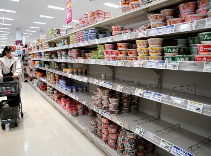 A shopper, wearing a protective mask, looks at shelves at a supermarket, following the outbreak of coronavirus disease (COVID-19), in Tokyo, Japan April 7, 2020. REUTERS/Naoki Ogura