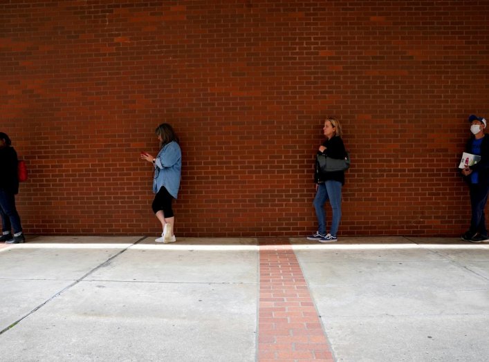 People who lost their jobs wait in line to file for unemployment benefits, following an outbreak of the coronavirus disease (COVID-19), at Arkansas Workforce Center in Fort Smith, Arkansas, U.S. April 6, 2020. REUTERS/Nick Oxford