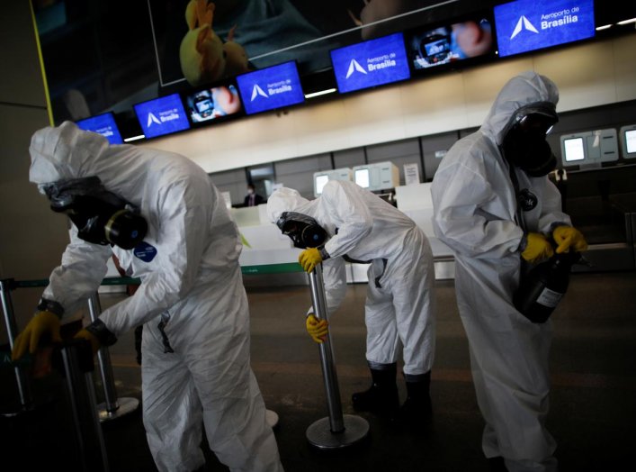 Members of the armed forces disinfect at Brasilia International Airport, amid the coronavirus disease (COVID-19) outbreak, in Brasilia, Brazil April 14, 2020. REUTERS/Ueslei Marcelino