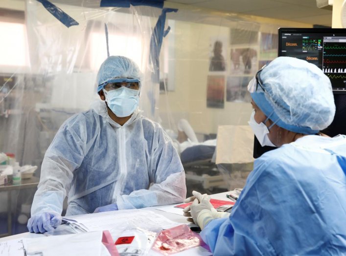 Medical staff, wearing protective suits and face masks, work in an intensive care unit for coronavirus disease (COVID-19) patients at the Franco-Britannique hospital in Levallois-Perret near Paris as the spread of the coronavirus disease continues in Fran